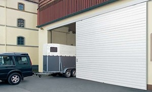 sliding garage door with horse trailier